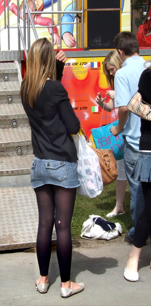 Auburn Teenage Girl wearing Black Sheer Leggings and Blue Denim Mini skirt