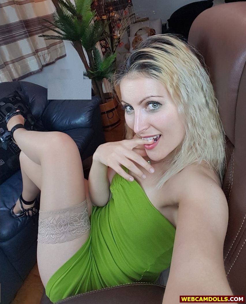 Blonde Girl in Tan Sheer Stockings and Green Short Dress on Webcamdolls