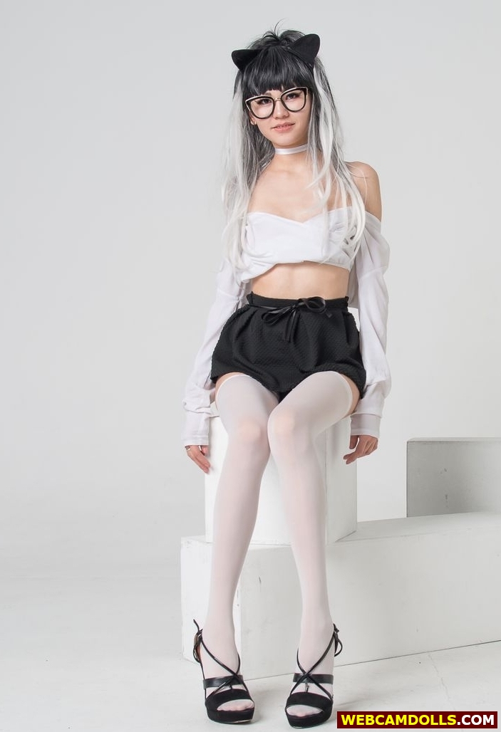 Teen Girl in Black Pleated Miniskirt and White Sheer Stockings on Webcamdolls