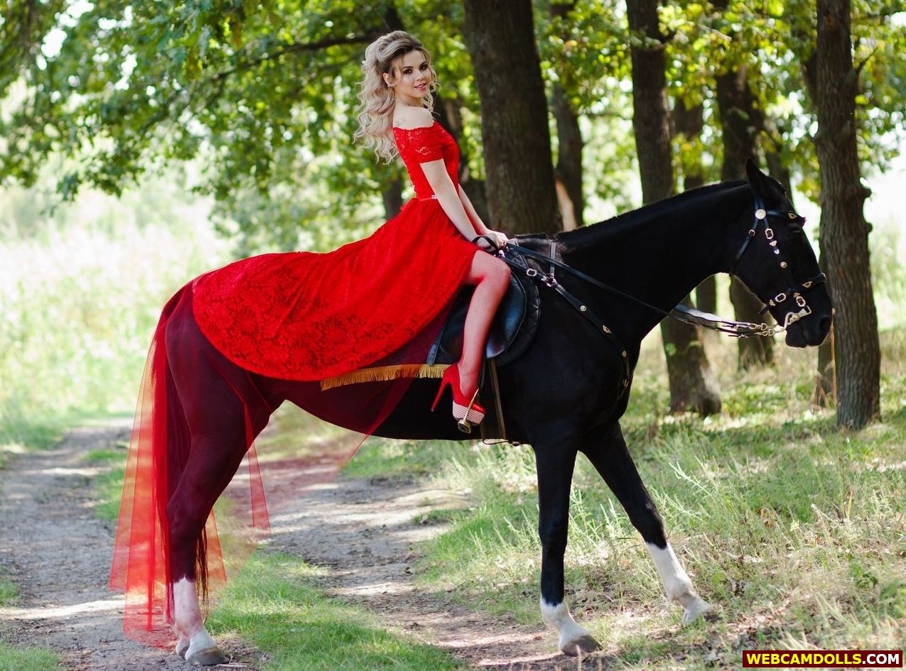 Blonde Young Horsewoman in Red Fishnet Tights and Long Tulle Dress on Webcamdolls