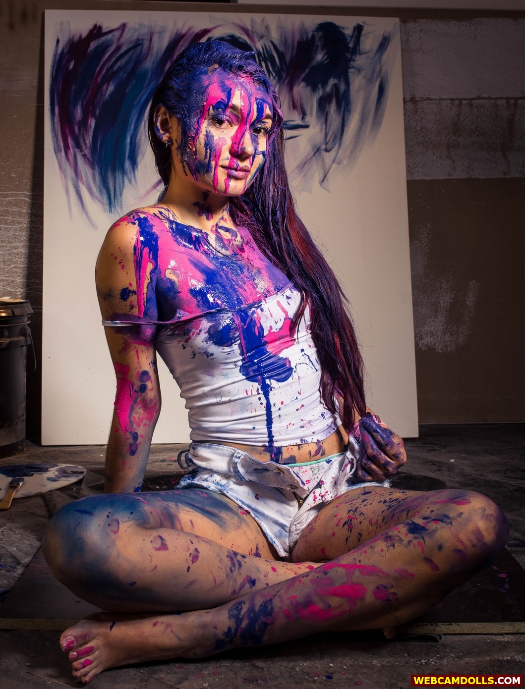 Messy Girl covered with Paint in Sleeveless Shirt and White Shorts on Webcamdolls