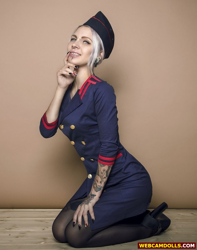 Blonde Girl in Stewardess Uniform and Black Seamed Pantyhose on Webcamdolls