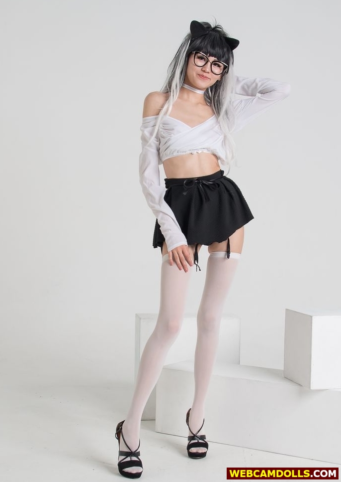 Teen Girl in White Sheer Stockings and Pleated Miniskirt on Webcamdolls