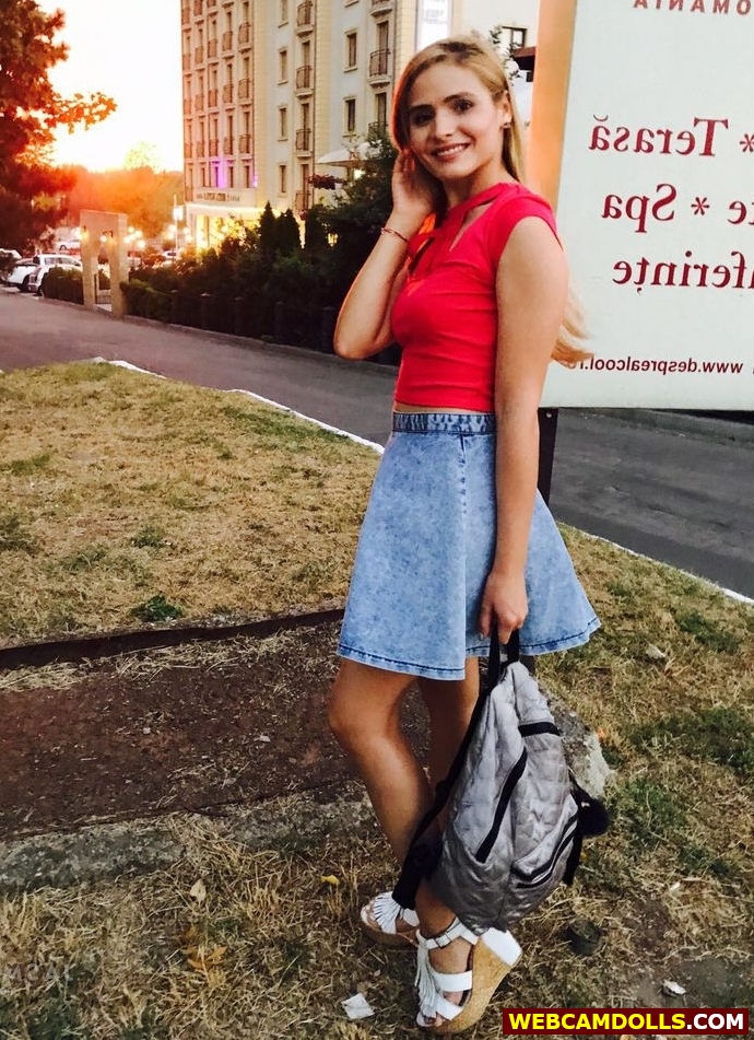 Blonde Girl In Blue Denim Mini Skirt And Red Tee Shir